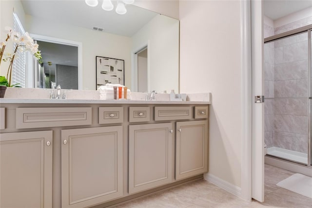 1221 Aloha Blvd, Davenport, FL 33897 - bathroom with a shower stall, double vanity, and baseboards