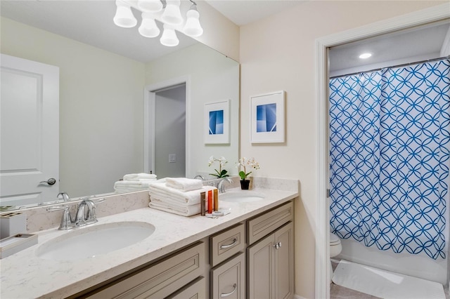 1221 Aloha Blvd, Davenport, FL 33897 - bathroom featuring toilet, double vanity, a chandelier, and a shower with curtain