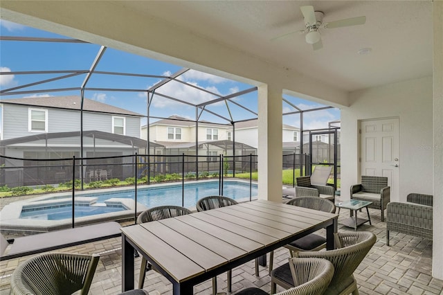 1221 Aloha Blvd, Davenport, FL 33897 - view of patio / terrace featuring a ceiling fan, a residential view, a lanai, outdoor dining area, and a pool with connected hot tub