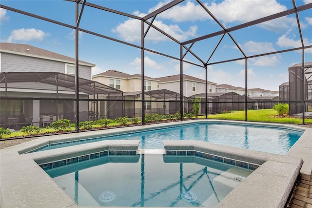 1221 Aloha Blvd, Davenport, FL 33897 - view of pool featuring a residential view, a pool with connected hot tub, glass enclosure, and a lawn