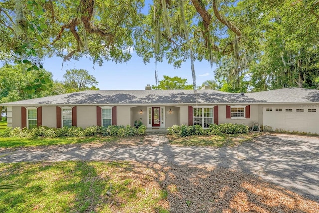 633 Balmoral Rd, Winter Park, FL 32789 - single story home featuring driveway and an attached garage