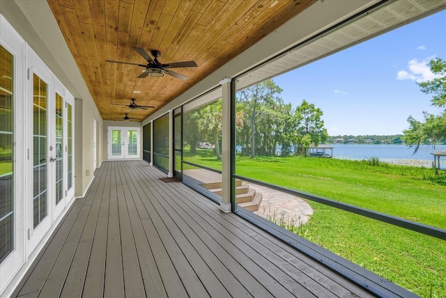 633 Balmoral Rd, Winter Park, FL 32789 - unfurnished sunroom featuring french doors, a water view, and a ceiling fan