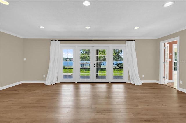 633 Balmoral Rd, Winter Park, FL 32789 - spare room featuring ornamental molding, french doors, wood finished floors, baseboards, and recessed lighting