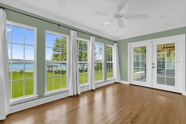 633 Balmoral Rd, Winter Park, FL 32789 - unfurnished sunroom featuring french doors and a water view