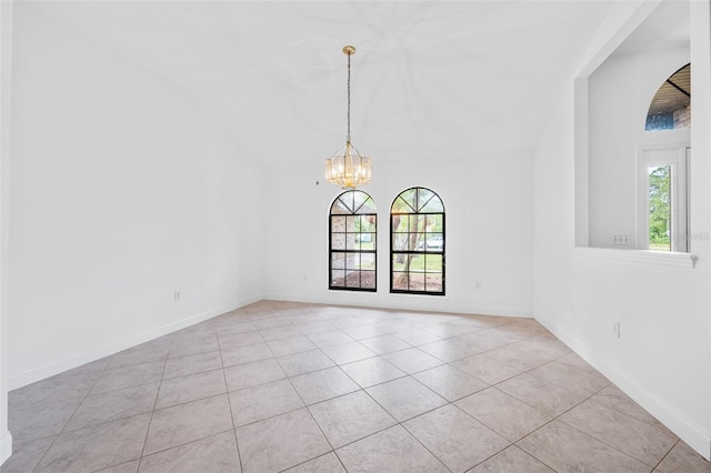 4206 Hield Rd NW, Palm Bay, FL 32907 - empty room featuring plenty of natural light, a chandelier, light tile patterned floors, and baseboards