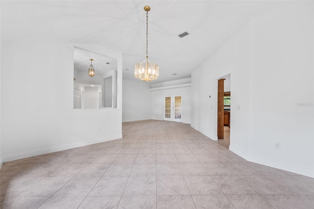 4206 Hield Rd NW, Palm Bay, FL 32907 - unfurnished room with a chandelier, light tile patterned floors, french doors, and baseboards