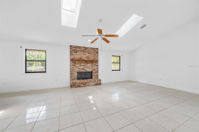 4206 Hield Rd NW, Palm Bay, FL 32907 - unfurnished living room with a skylight, light tile patterned flooring, a brick fireplace, a ceiling fan, and high vaulted ceiling
