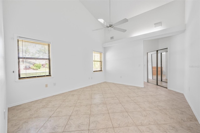 4206 Hield Rd NW, Palm Bay, FL 32907 - unfurnished room with healthy amount of natural light, high vaulted ceiling, a ceiling fan, and baseboards