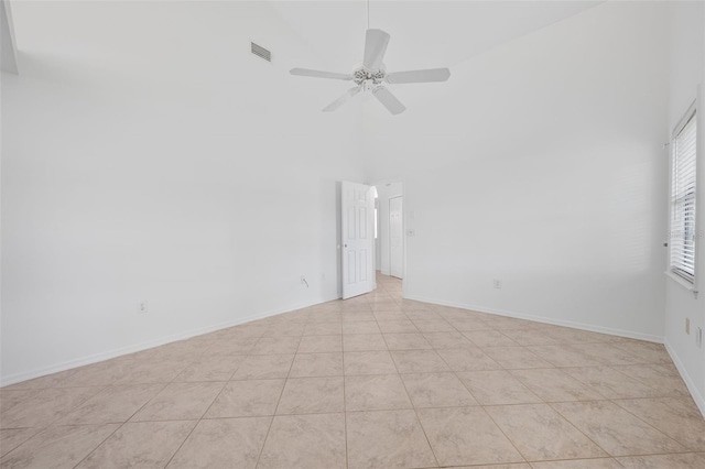 4206 Hield Rd NW, Palm Bay, FL 32907 - empty room with high vaulted ceiling, ceiling fan, baseboards, and light tile patterned flooring
