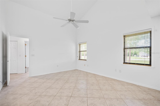 4206 Hield Rd NW, Palm Bay, FL 32907 - spare room with high vaulted ceiling, a ceiling fan, light tile patterned floors, and baseboards