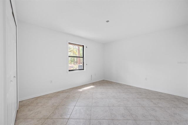 4206 Hield Rd NW, Palm Bay, FL 32907 - spare room with light tile patterned floors and baseboards