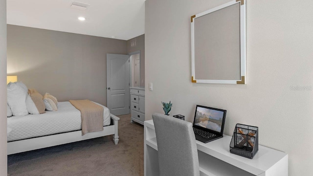 bedroom featuring carpet and a desk