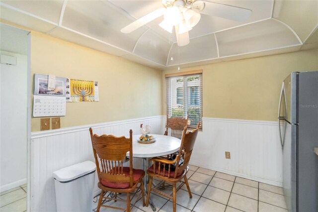 6 Escondido Cir Unit 55, Altamonte Springs, FL 32701 - dining space featuring a wainscoted wall, light tile patterned floors, and ceiling fan