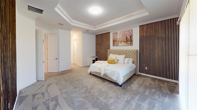 8851 Fallen Oak Dr, Davenport, FL 33896 - carpeted bedroom with a tray ceiling and ornamental molding