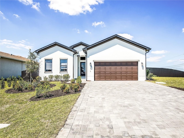 2545 NW 22nd Pl, Cape Coral, FL 33993 - ranch-style home with decorative driveway, stucco siding, and a garage