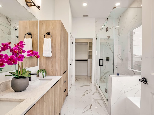 2545 NW 22nd Pl, Cape Coral, FL 33993 - full bathroom with a marble finish shower, marble tiled flooring, a garden tub, recessed lighting, and double vanity