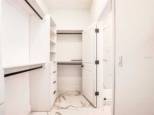 2545 NW 22nd Pl, Cape Coral, FL 33993 - walk in closet featuring light marble finish floors