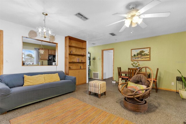 3162 Little Sound Dr, Orlando, FL 32827 - living room with speckled floor, a ceiling fan, and a chandelier