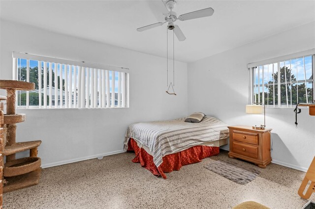 3162 Little Sound Dr, Orlando, FL 32827 - bedroom with multiple windows, baseboards, and speckled floor