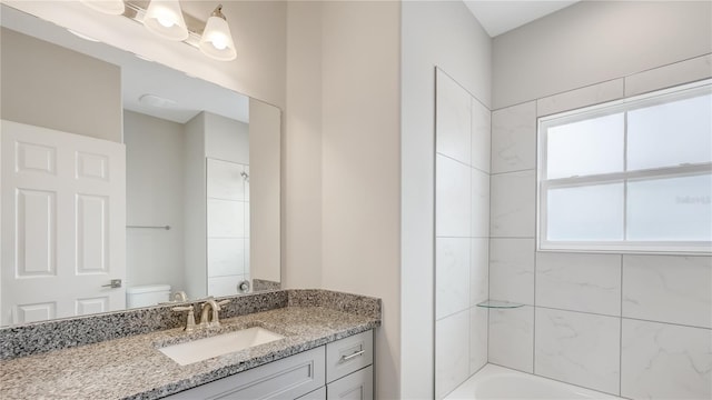 8560 Magnificent Ln, Groveland, FL 34736 - full bathroom with toilet, vanity, and  shower combination