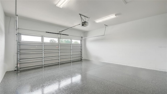 8560 Magnificent Ln, Groveland, FL 34736 - garage with a garage door opener and concrete block wall