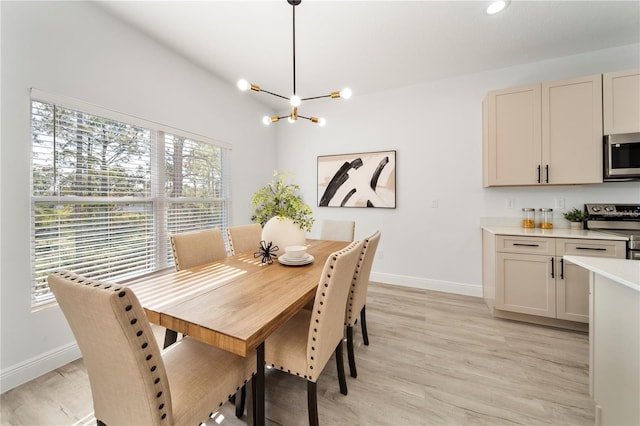 dining area featuring baseboards, a chandelier, light wood finished floors, and recessed lighting