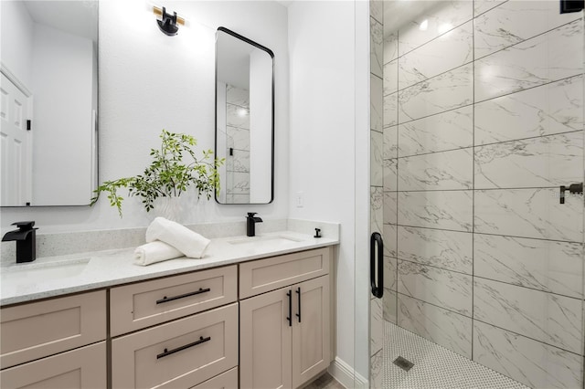 bathroom featuring a stall shower and double vanity