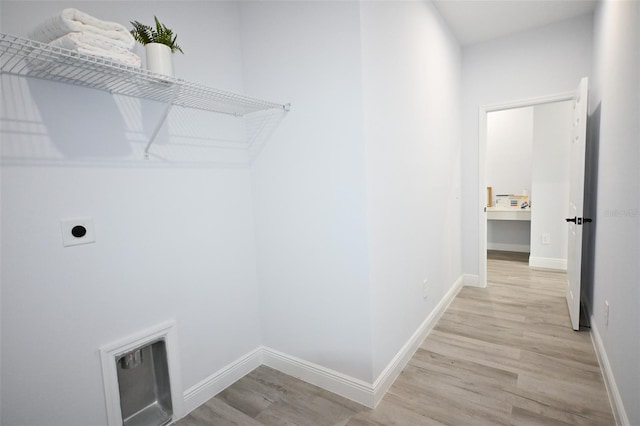 921 Sable Cir SE, Palm Bay, FL 32909 - laundry room featuring hookup for an electric dryer, wood finished floors, and baseboards
