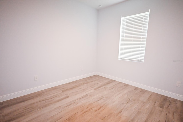 921 Sable Cir SE, Palm Bay, FL 32909 - empty room with light wood-style flooring and baseboards