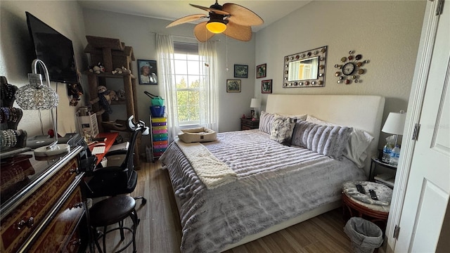 bedroom featuring wood finished floors and a ceiling fan