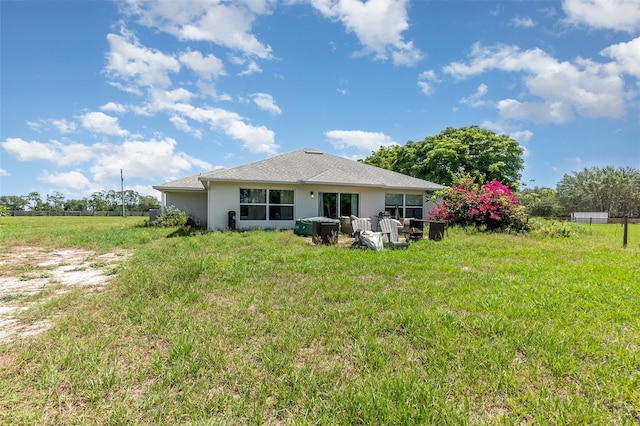 rear view of property with stucco siding