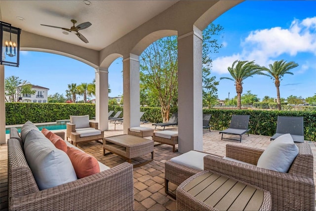 view of patio with outdoor lounge area, ceiling fan, and fence
