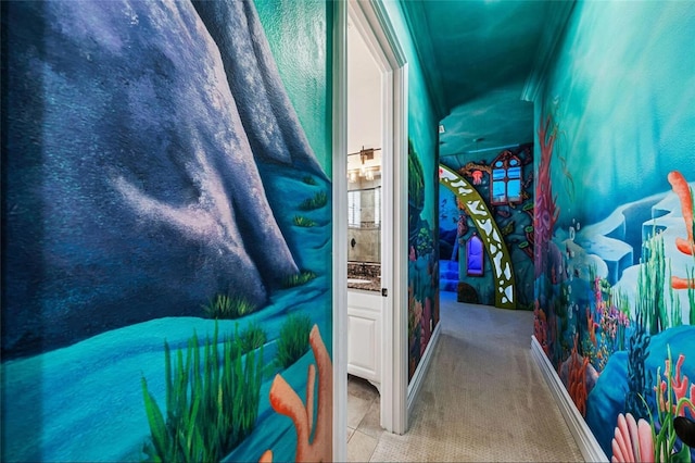 hallway featuring ornamental molding and carpet floors
