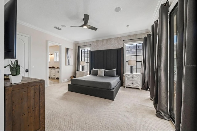 bedroom featuring light colored carpet, crown molding, baseboards, a ceiling fan, and ensuite bathroom