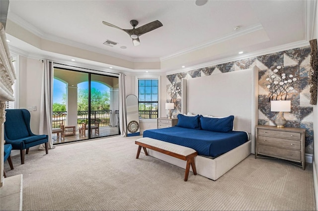 bedroom with carpet floors, a raised ceiling, access to exterior, ornamental molding, and a ceiling fan