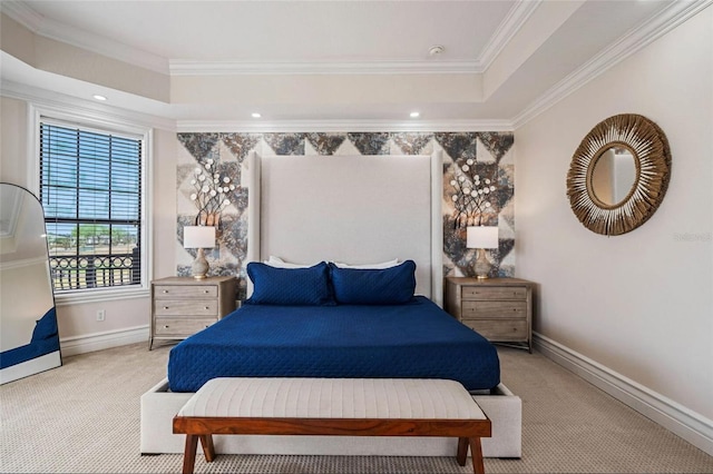 bedroom featuring carpet floors, a raised ceiling, baseboards, and ornamental molding