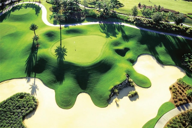 surrounding community featuring view of golf course