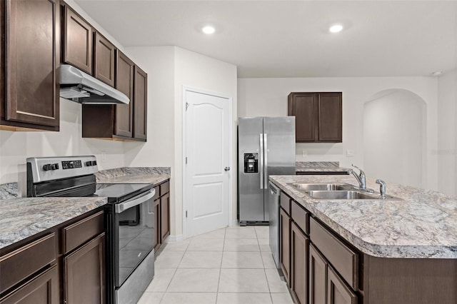 979 Sun Burst Rd, Winter Haven, FL 33880 - kitchen featuring appliances with stainless steel finishes, a sink, under cabinet range hood, dark brown cabinets, and recessed lighting