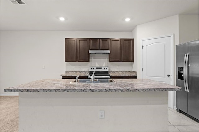 979 Sun Burst Rd, Winter Haven, FL 33880 - kitchen featuring stainless steel appliances, a sink, dark brown cabinetry, light countertops, and recessed lighting