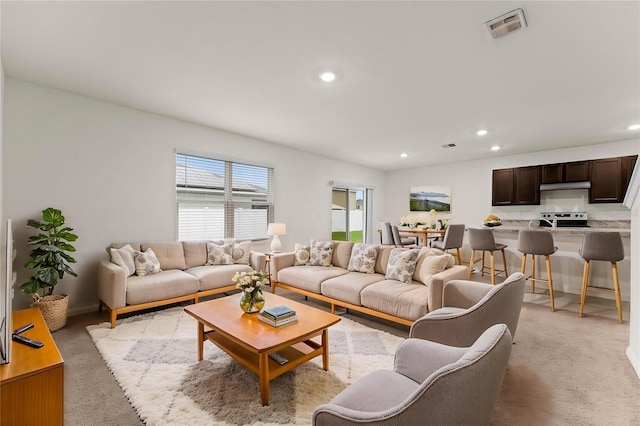 979 Sun Burst Rd, Winter Haven, FL 33880 - living room with recessed lighting and light carpet