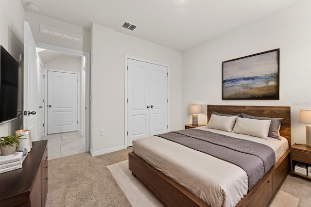 979 Sun Burst Rd, Winter Haven, FL 33880 - bedroom with light carpet, a closet, and baseboards