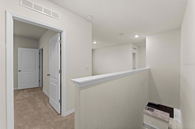 979 Sun Burst Rd, Winter Haven, FL 33880 - hallway featuring light colored carpet, recessed lighting, and baseboards