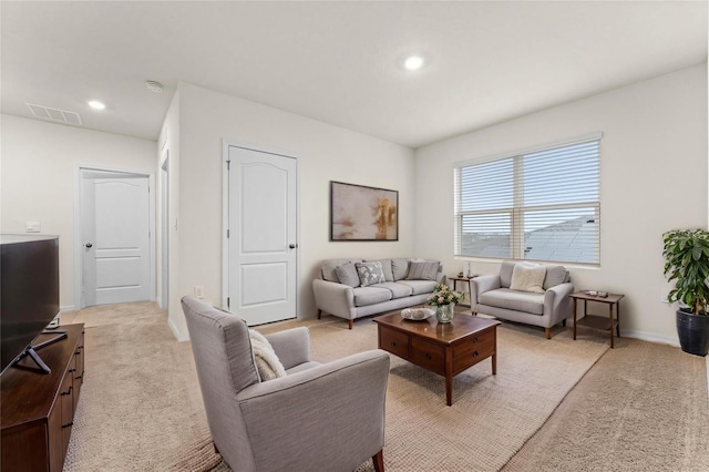 979 Sun Burst Rd, Winter Haven, FL 33880 - living area featuring light carpet, recessed lighting, and baseboards