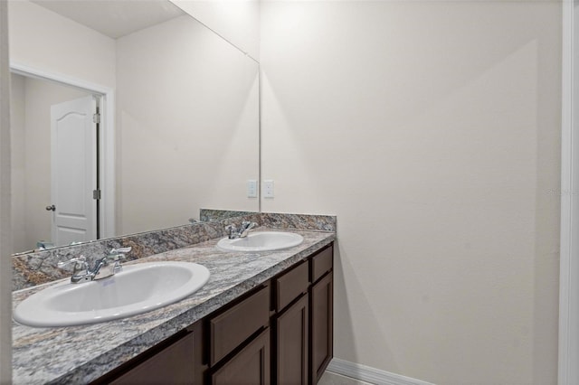 979 Sun Burst Rd, Winter Haven, FL 33880 - bathroom with baseboards and double vanity