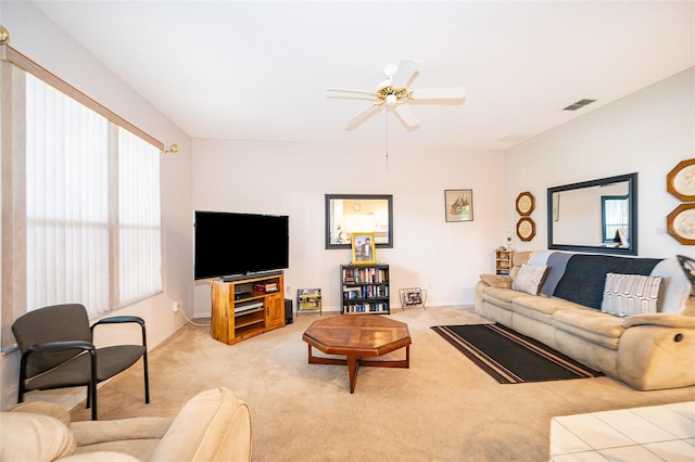 living room with ceiling fan and light colored carpet