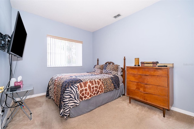 bedroom featuring carpet floors and baseboards