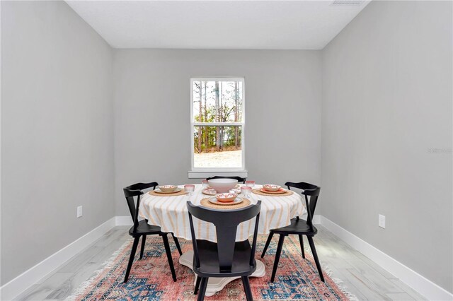 6106 SW 127 Avenue Rd, Ocala, FL 34481 - dining room with baseboards and light wood-style floors