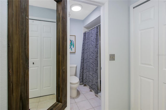 7858 Sugar View Ct Unit 7858, Orlando, FL 32819 - full bathroom featuring a closet, toilet, tile patterned floors, and curtained shower