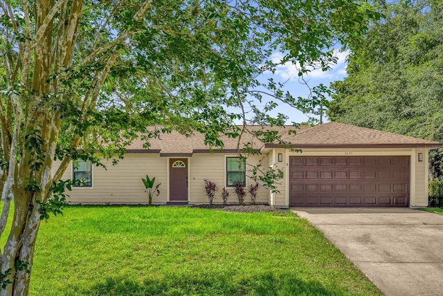 3685 Sunday Dr, Deltona, FL 32738 - ranch-style house with a front yard, an attached garage, concrete driveway, and roof with shingles