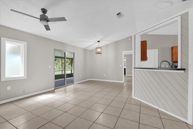 3685 Sunday Dr, Deltona, FL 32738 - unfurnished room featuring a ceiling fan, light tile patterned flooring, baseboards, and vaulted ceiling